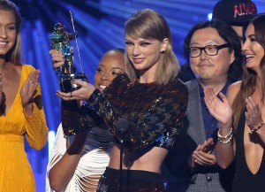 Taylor Swift accepts the award for video of the year for Bad Blood at the MTV Video Music Awards at the Microsoft Theater on Sunday, Aug. 30, 2015, in Los Angeles. Pictured from left is Gigi Hadid, Serayah, director Joseph Kahn and Lily Aldridge. (Photo by Matt Sayles/Invision/AP)